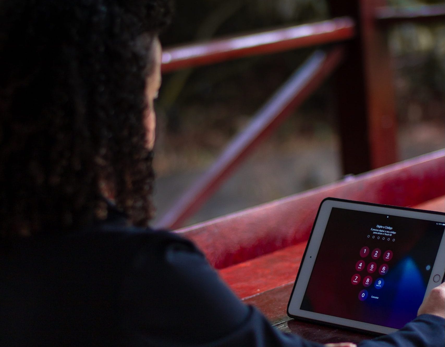 Girl Enterping Passcode into Ipad